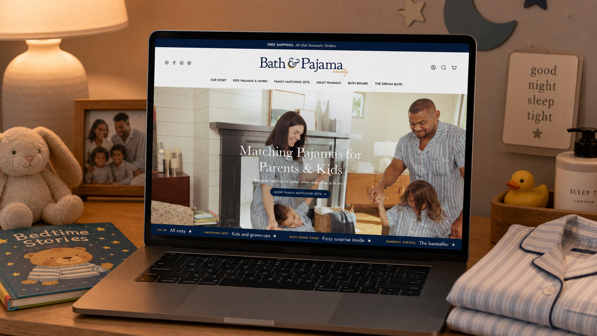 Bath and Pajama Society Shopify homepage on laptop in branded scene